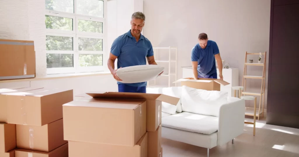 Our Moving and Packing Services in Deltona, FL team packing fragile items securely for a move.